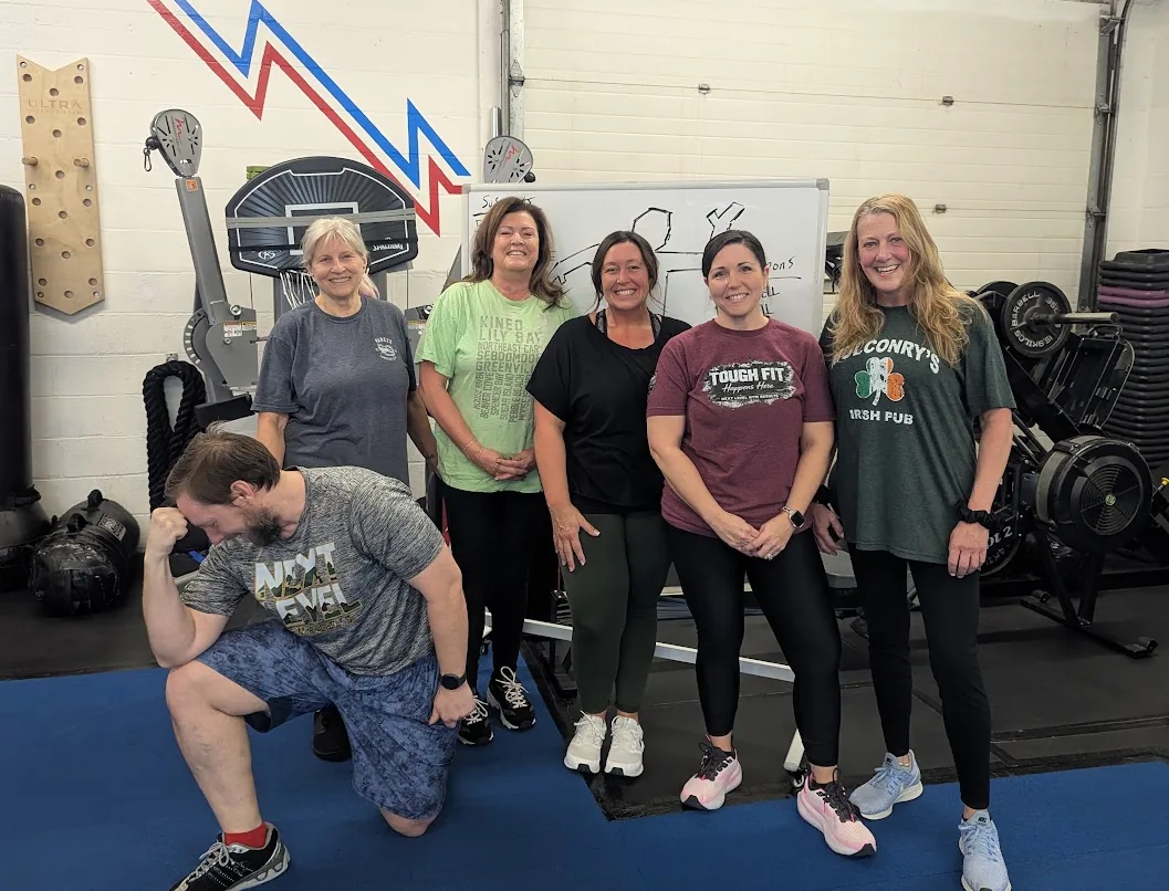 Next Level Gym Results members together on the gym turf in Canandaigua