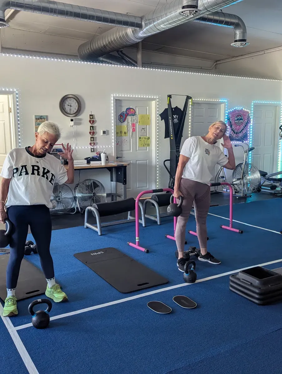 Members training with kettlebells in a class at Next Level Gym